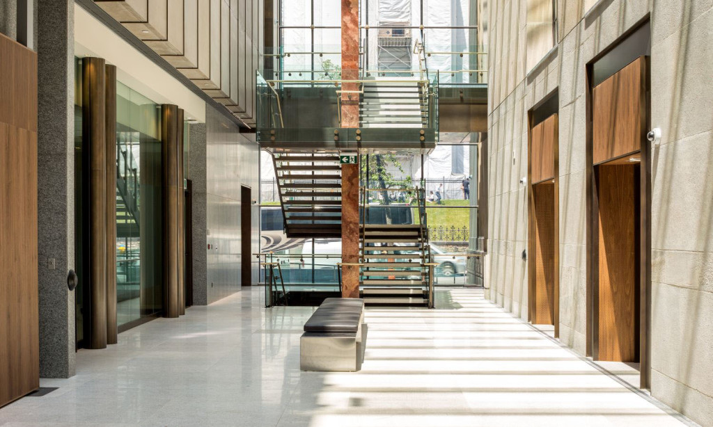 Looking north in the atrium highlighting the new feature stair with the addition on the left and the existing building on the right (Doublespace)