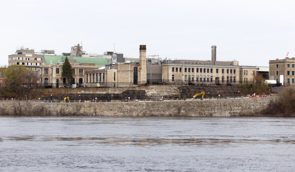 Ottawa River in foreground, Canadian Mint and buildings in background.